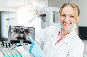 Dentist showing digital dental x-rays