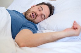 Man in blue shirt with sleep apnea near Bourne, MA