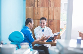 Dentist and patient discussing treatment plan