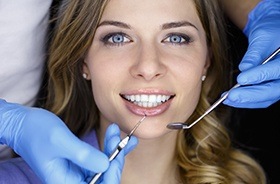 Woman receiving dental exam