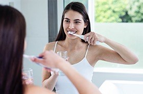 Woman brushing her teeth