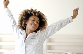 woman stretching after restful sleep