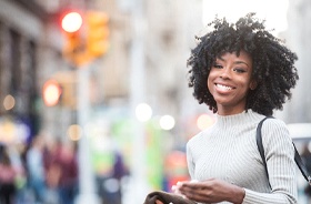 Smiling young woman enjoying benefits of tooth-colored fillings