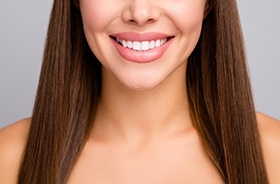 Woman’s beautiful smile with white, straight teeth