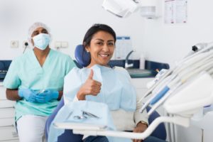 Happy patient at appointment to use her dental insurance in Buzzards Bay