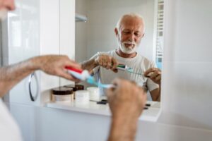 Senior man preparing to brush his teeth
